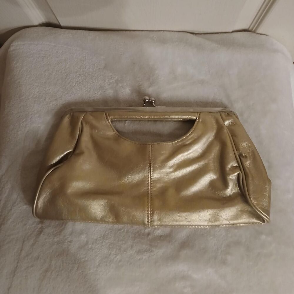 Y2K vintage gold metallic clutch bag with silver kiss lock closure and hardware
